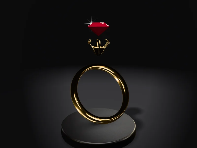 Chiếc nhẫn SC-15 tách thành ba lớp lơ lửng trên bệ nhung đen: viên ruby đỏ thẫm ở trên cùng, ổ sáu chấu vàng ở giữa, đai vàng 18K đứng bên dưới